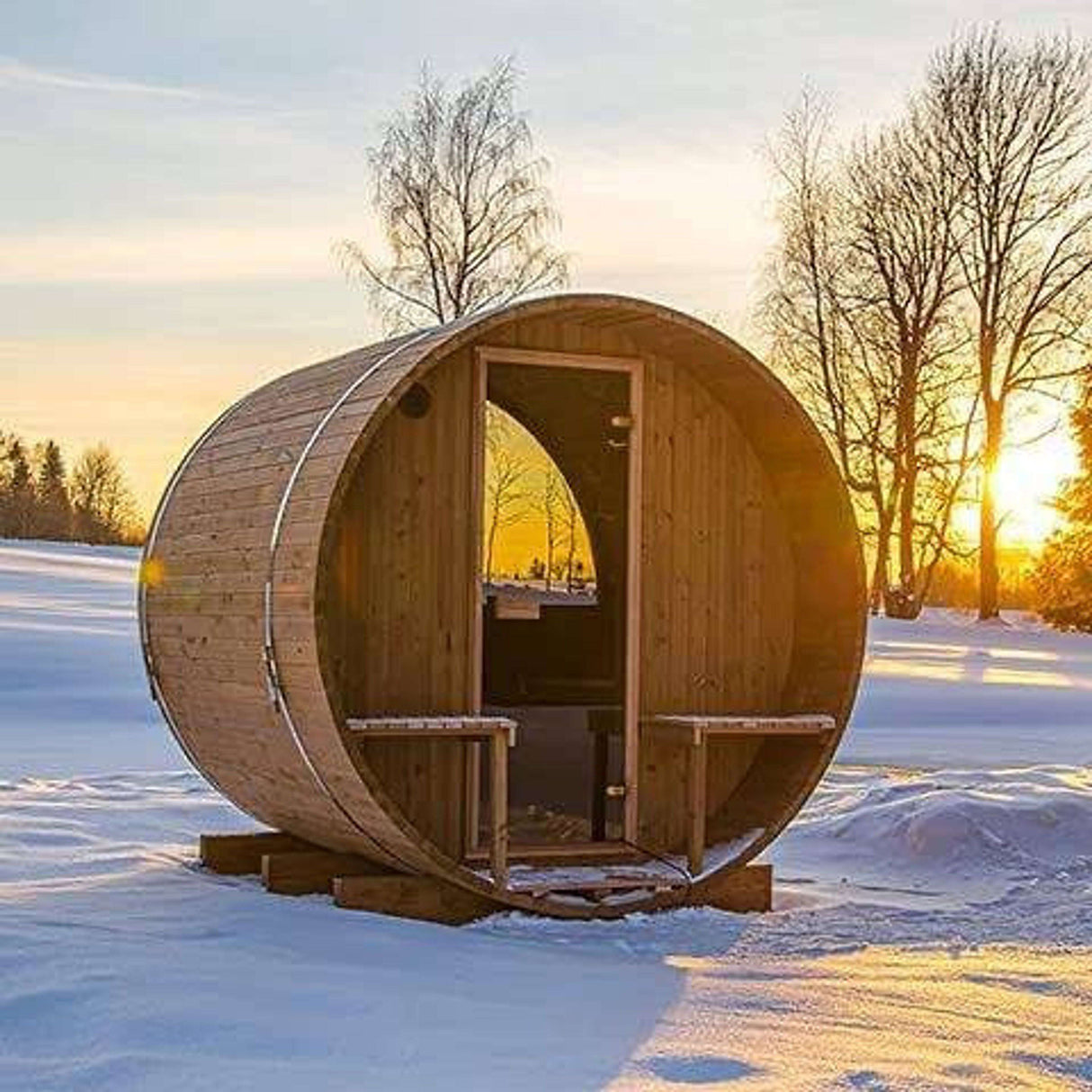 Thermory Barrel Sauna Model #60 DIY Kit placed in snowy landscape with open door and porch. Winter-ready outdoor sauna for 4 people.