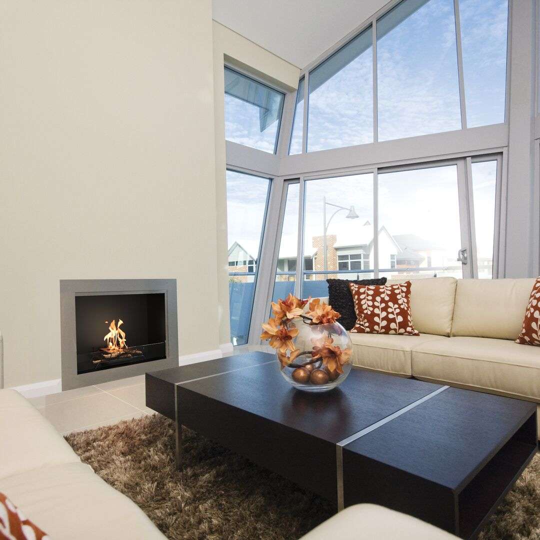 EcoSmart Heritage 42SS Ethanol Fireplace Insert installed in a modern living room, enhancing home ambiance with clean-burning flame and sleek design.