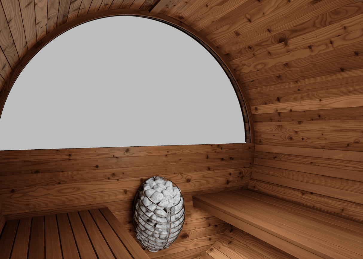 Interior of Thermory Barrel Sauna Model #60 DIY Kit featuring curved wood benches and 7.5kw heater. Spacious design for 4-person relaxation.