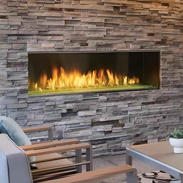 Majestic Lanai 60 outdoor linear gas fireplace on a front porch with crushed glass media