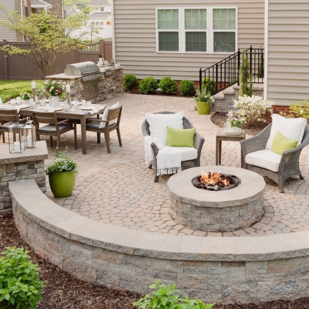 Backyard setup featuring Firegear DIY Fire Pit Kit - Round surrounded by patio seating and dining area, perfect for entertaining.