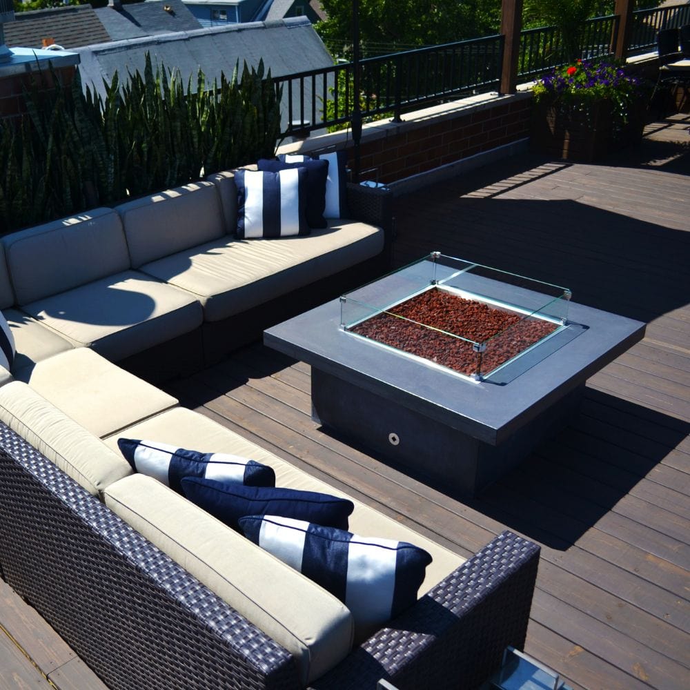 Contemporary outdoor seating area with Firegear DIY Fire Pit Kit - Square featuring lava rock media and glass wind guard.