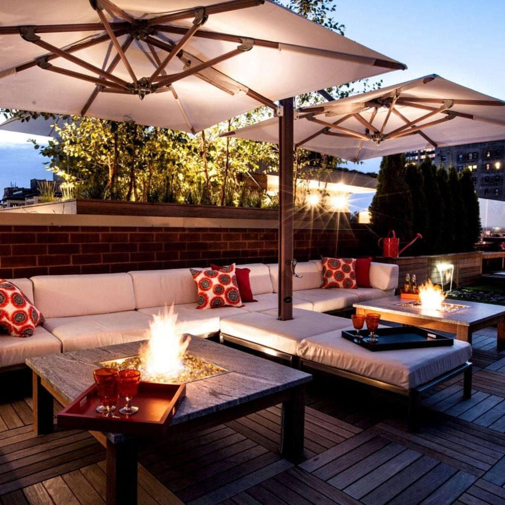 Modern rooftop patio with Firegear DIY Fire Pit Kit - Square installed in a sleek table, creating a cozy ambiance with adjustable flame.