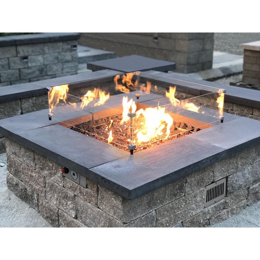 Firegear DIY Fire Pit Kit - Square installed in a stone fire pit with glass wind guard and vibrant flames for outdoor warmth.