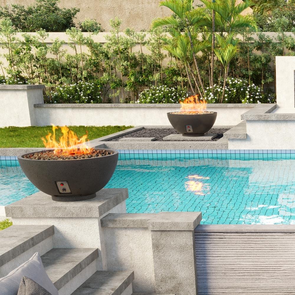 Poolside setup with dual Firegear Sanctuary 30-Inch Round Concrete Gas Fire Bowls in Raven finish, enhancing outdoor ambiance.