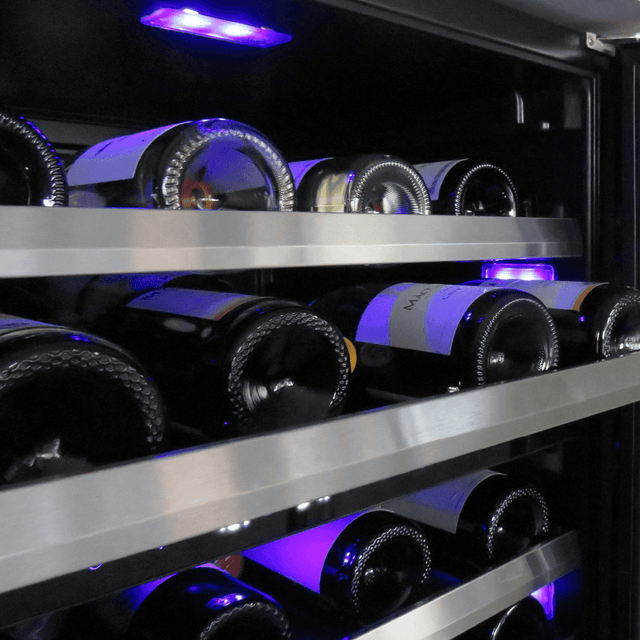 Interior of XO 24 Inch Dual Zone Wine Cooler showing wine bottles on stainless steel racks with blue LED lighting.