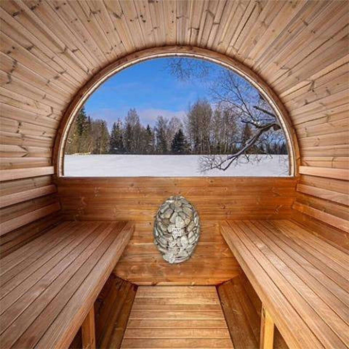 Interior view of Thermory Barrel Sauna Model #60 DIY Kit showing benches and heater with scenic winter view through panoramic window.