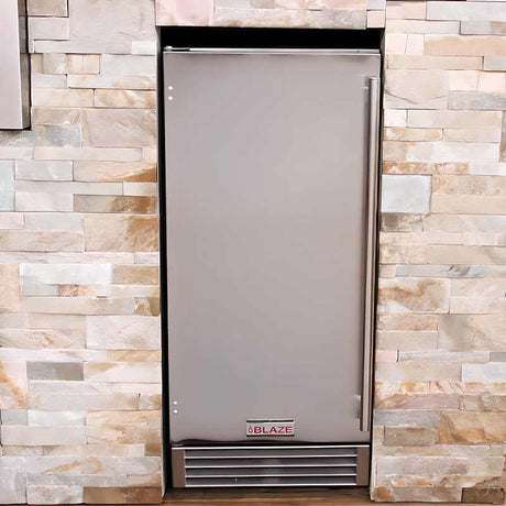 Blaze 15 inch outdoor rated ice maker built into a stainless outdoor kitchen island