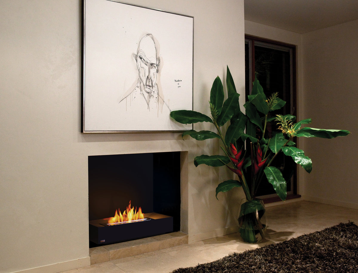 EcoSmart Fire Grate 30 ethanol burner lit in a living room fireplace