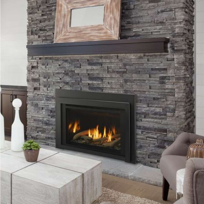 Majestic Ruby 30 direct vent gas insert installed in a masonry fireplace with a black surround