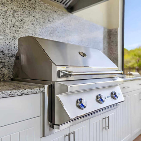 Twin Eagles 36 inch built-in gas grill installed in a stone outdoor kitchen