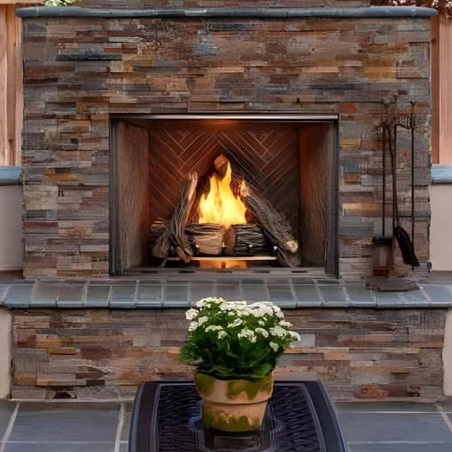 Majestic Courtyard 42 outdoor gas fireplace in an outdoor lounge area with high definition log set