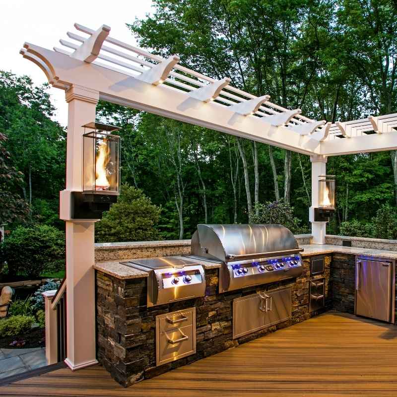 Tempest Torch wall-mounted on a pergola