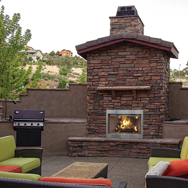 Superior WRE3000 outdoor wood fireplace installed in a stone surround