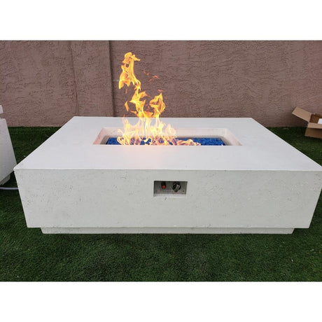 Firegear Sanctuary Rectangular Concrete Gas Fire Pit Table in Arctic finish with blue fire glass, ignited for vibrant flame display.