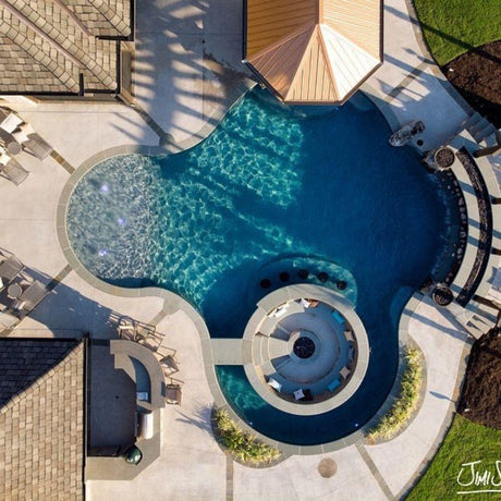 Aerial view of luxury backyard with integrated Firegear Sanctuary 30-Inch Round Concrete Gas Fire Bowl in sunken seating area.
