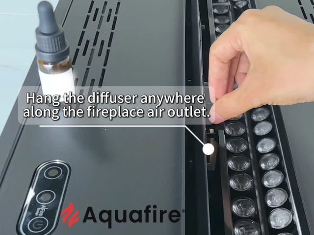Aquafire scent diffuser positioned in the vapor path of a water vapor fireplace