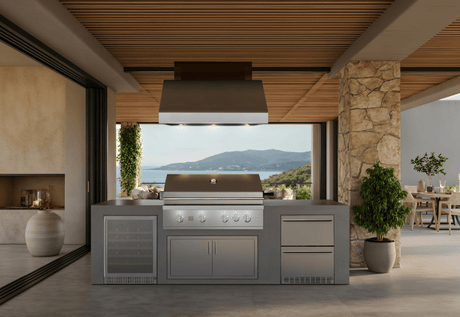 Summerset outdoor vent hood installed over a built-in grill in a covered outdoor kitchen